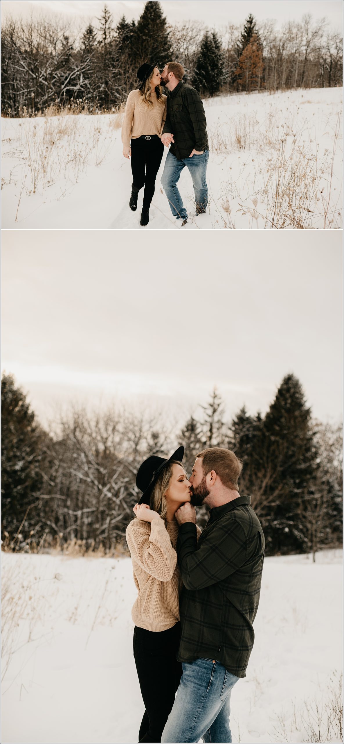 engagement session couple is walking and kissing her hand on her hat his hand under her chin in the snow with a mix of trees with snow in the background